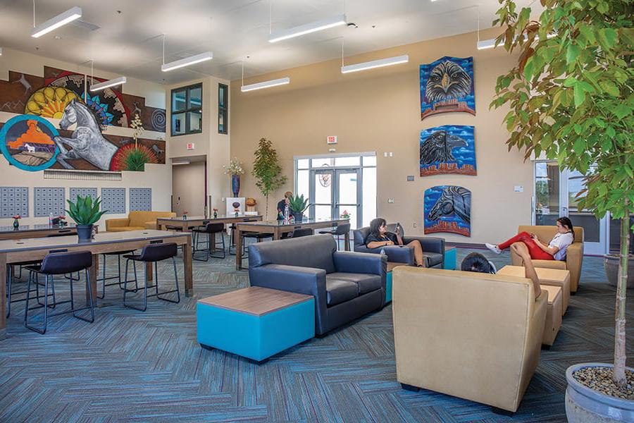Students relax in the main lounge area at Nizhoni Sunrise Suites.